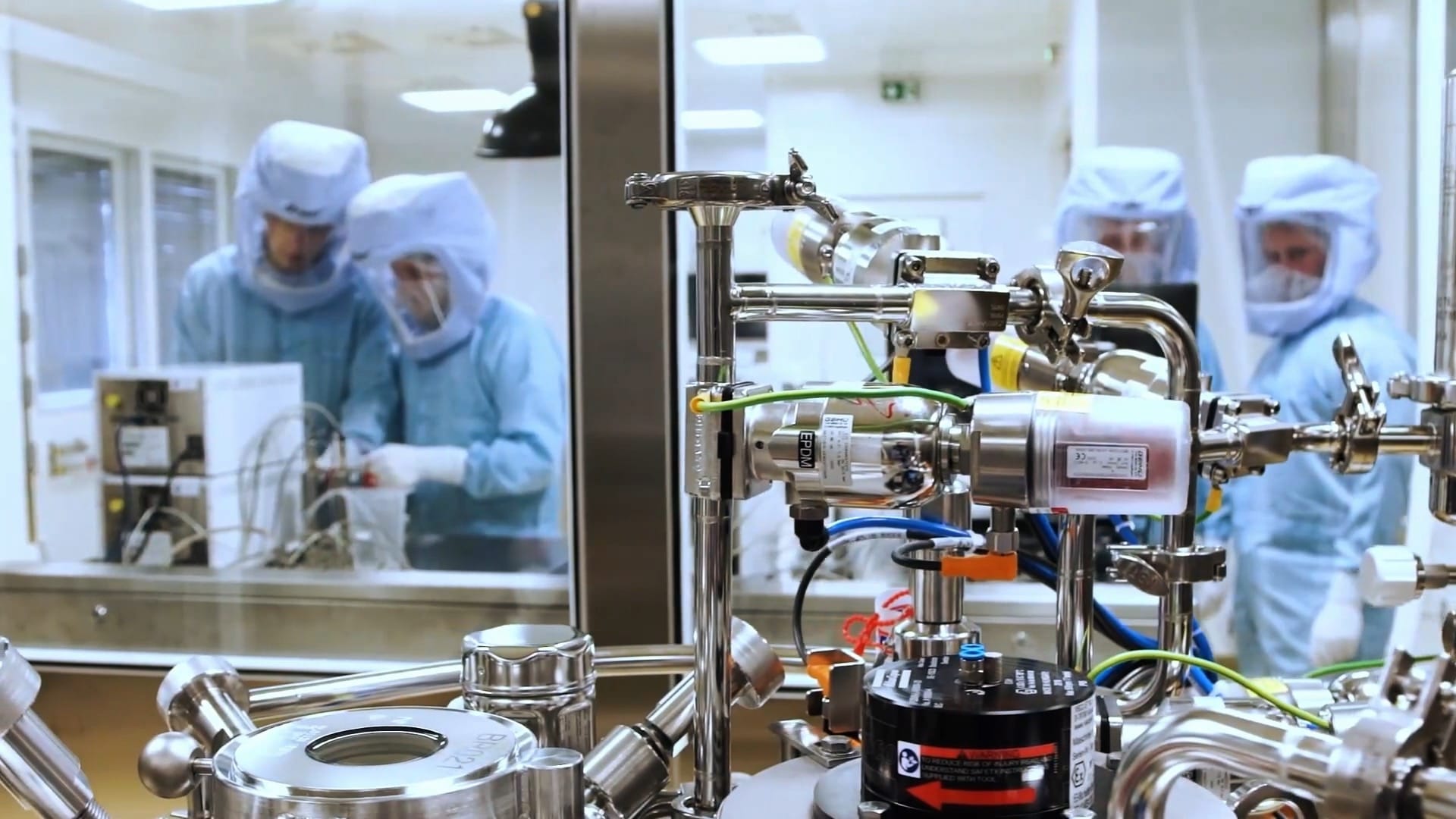 Employees prepare part of the production line